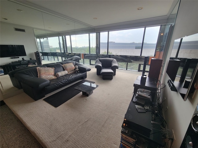 living room with expansive windows, ornamental molding, carpet flooring, and a water view