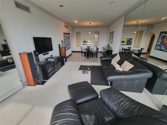 carpeted living room featuring ornamental molding