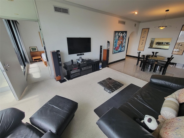 carpeted living room with crown molding