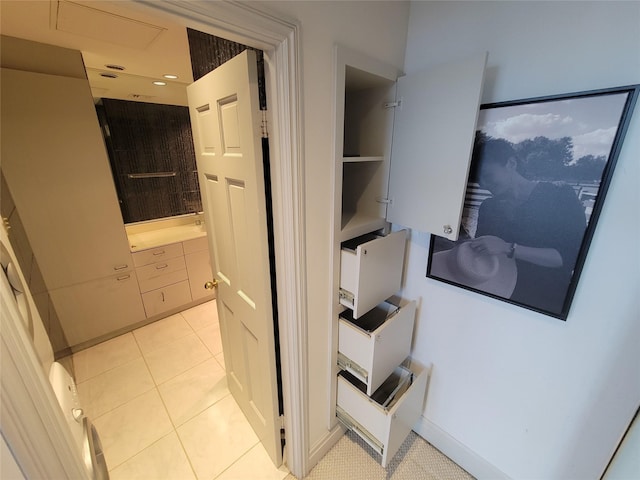 hallway featuring light tile patterned floors