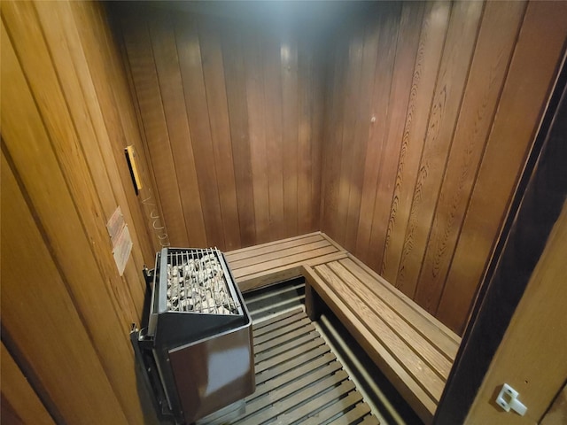 view of sauna with wood walls