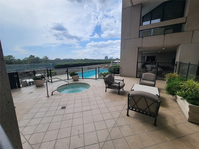 view of pool with a community hot tub and a patio