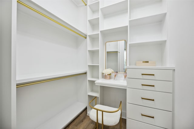 walk in closet featuring dark wood-type flooring