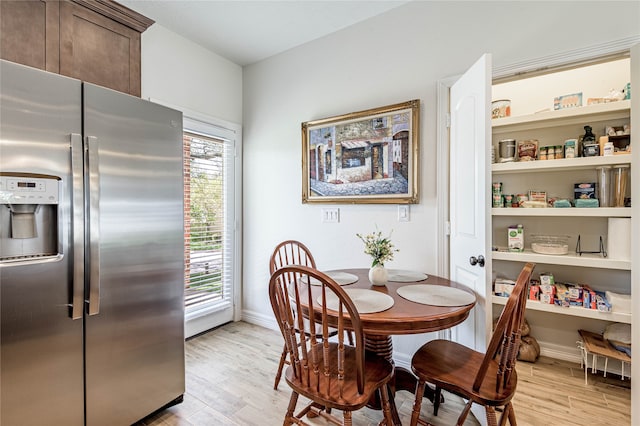 dining room with light wood-type flooring