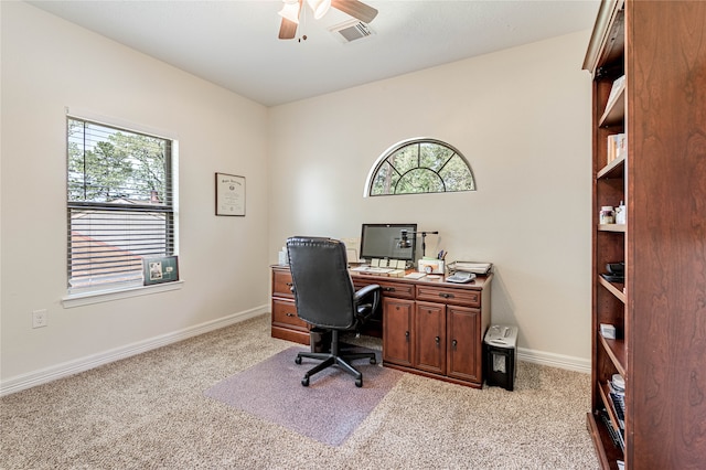 office space with light colored carpet and ceiling fan