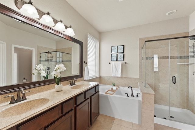 bathroom with vanity, shower with separate bathtub, and tile patterned flooring