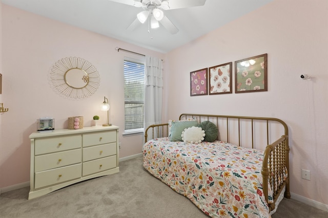 bedroom with light carpet and ceiling fan