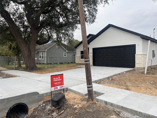 ranch-style house featuring a garage