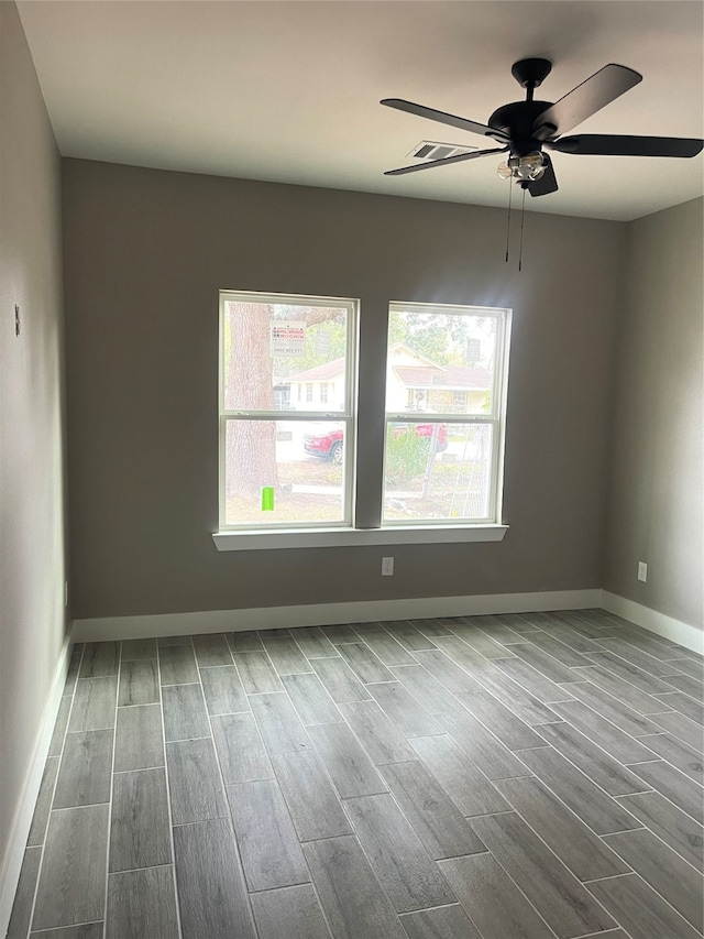 unfurnished room featuring hardwood / wood-style floors and ceiling fan