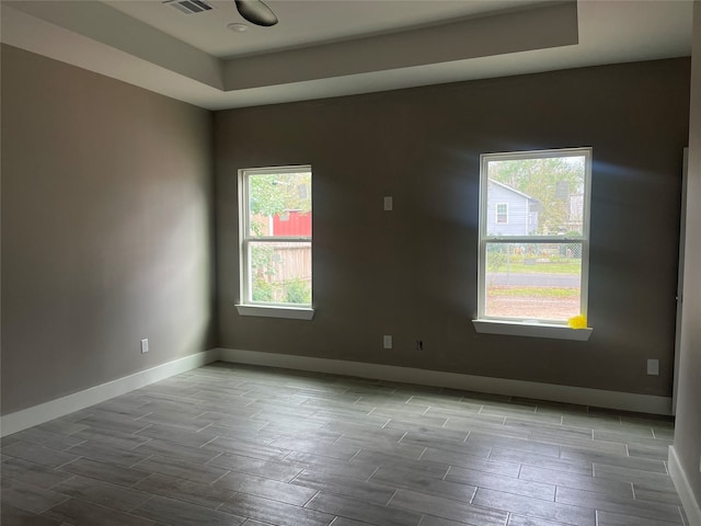 unfurnished room featuring plenty of natural light and light hardwood / wood-style flooring