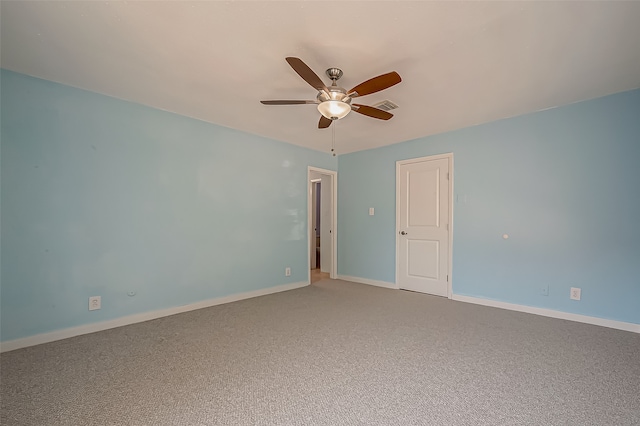 unfurnished room with ceiling fan and carpet floors