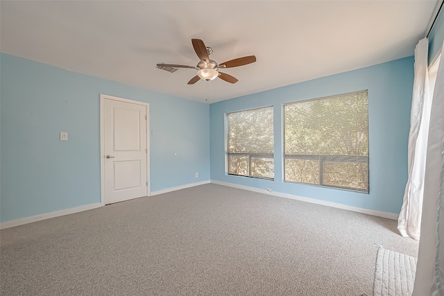 spare room featuring carpet floors and ceiling fan