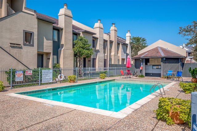 view of pool featuring a patio