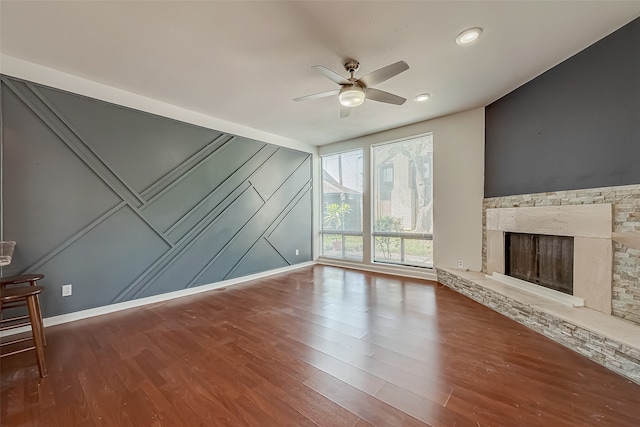 unfurnished living room with hardwood / wood-style flooring, a fireplace, and ceiling fan