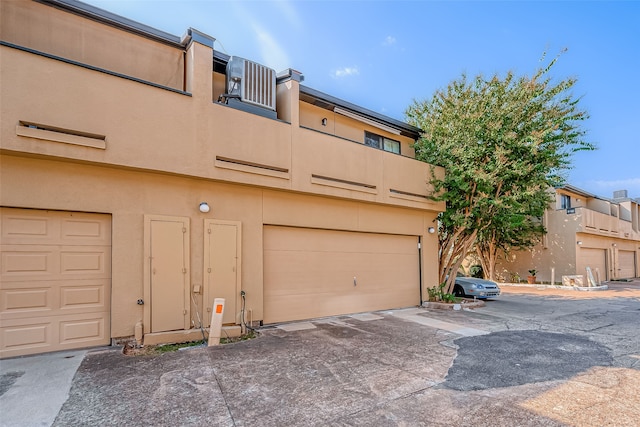 exterior space featuring a balcony and a garage