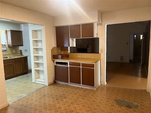 kitchen featuring dark brown cabinets