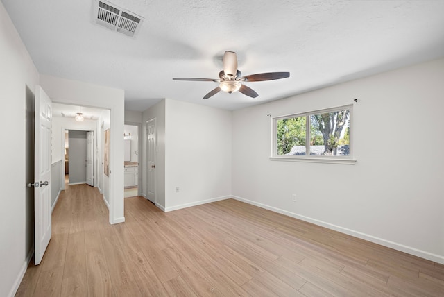 unfurnished bedroom featuring ceiling fan and light hardwood / wood-style floors