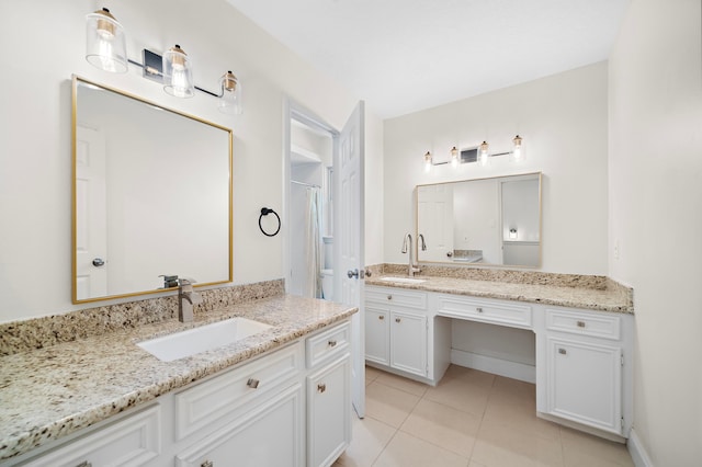 bathroom with tile patterned flooring, a shower with shower curtain, and vanity