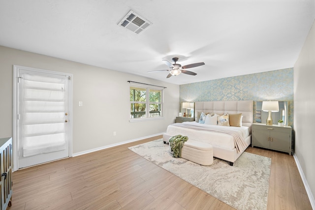 bedroom featuring ceiling fan and light hardwood / wood-style flooring