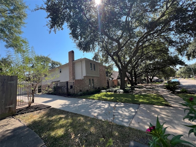 view of home's exterior with a lawn