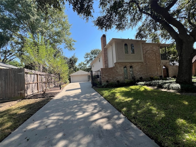 view of front of home featuring a front lawn and a garage