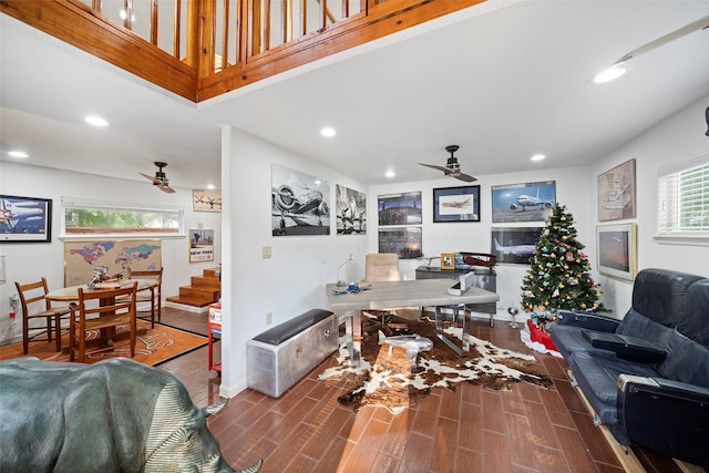 living room featuring ceiling fan and wood-type flooring