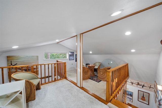 interior space with lofted ceiling and carpet flooring