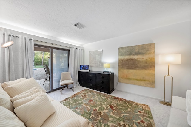 interior space with access to outside and a textured ceiling