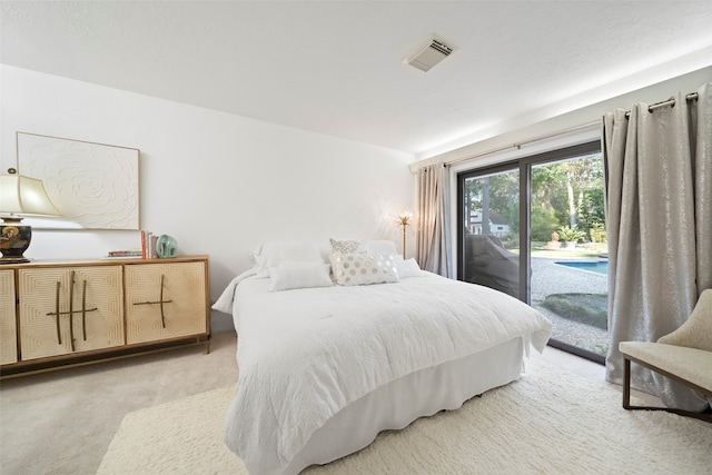 carpeted bedroom with access to outside