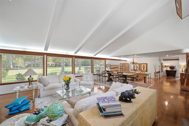 living room with lofted ceiling with beams, a chandelier, and wood-type flooring