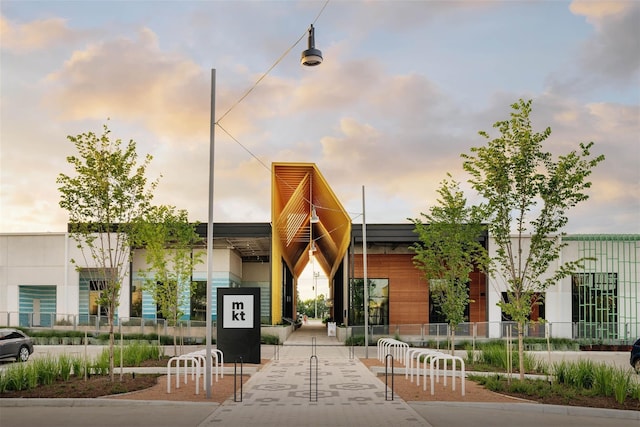 view of outdoor building at dusk