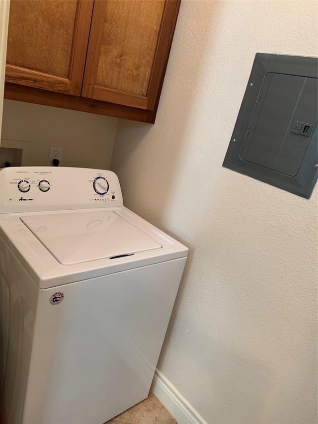 laundry room with electric panel, cabinets, washer / clothes dryer, and light tile patterned flooring