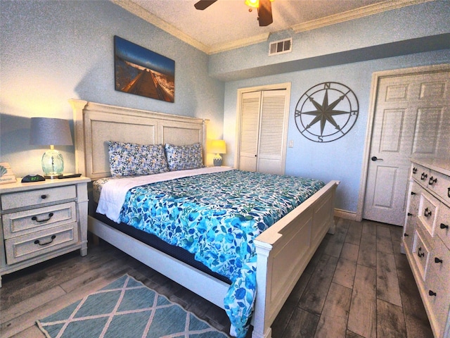 bedroom featuring a closet, ceiling fan, crown molding, and dark wood-type flooring