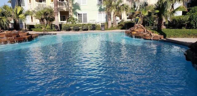 view of pool featuring pool water feature