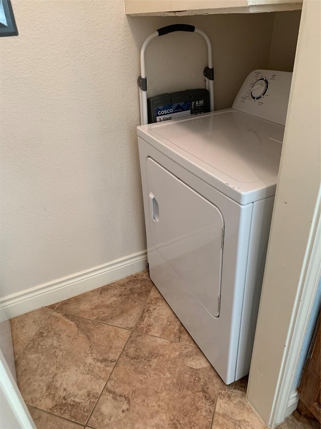 washroom with washer / clothes dryer