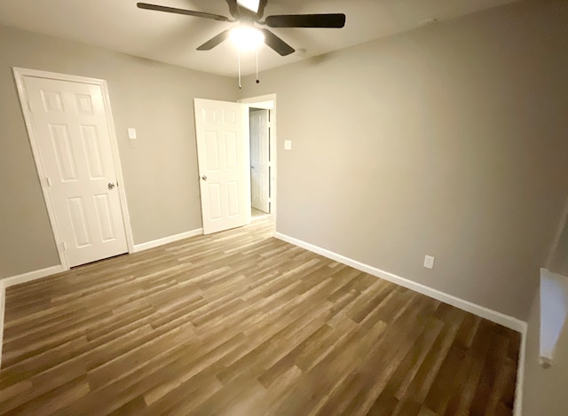 unfurnished bedroom with hardwood / wood-style floors and ceiling fan