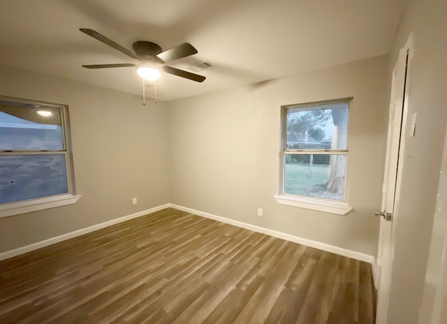 unfurnished room featuring ceiling fan and hardwood / wood-style flooring