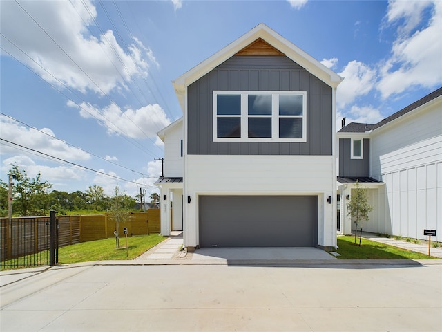 view of front of house with a front lawn and a garage