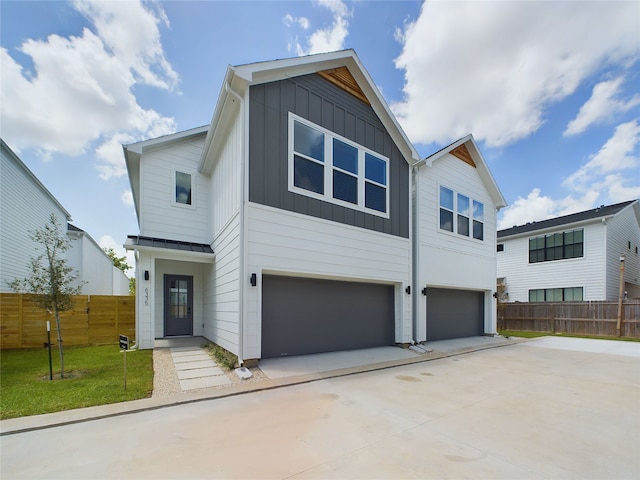 view of front of home featuring a front yard and a garage