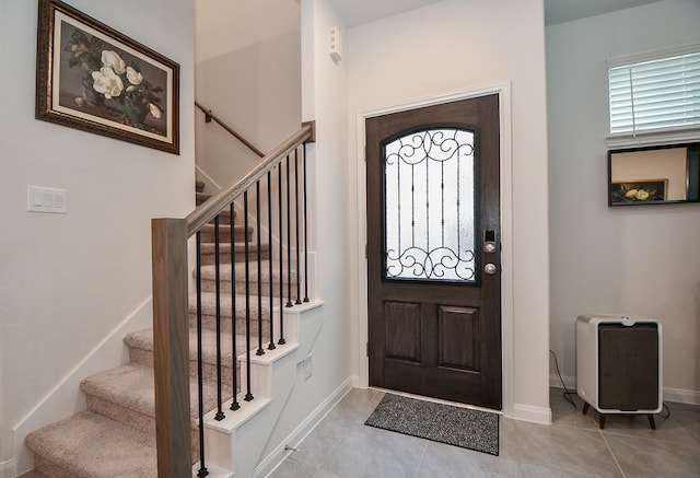 foyer featuring light tile patterned flooring