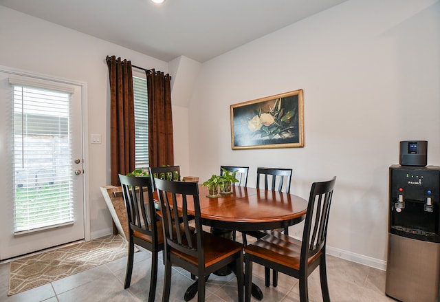 dining area featuring plenty of natural light and light tile patterned floors