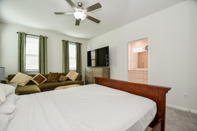 carpeted bedroom featuring ceiling fan and connected bathroom