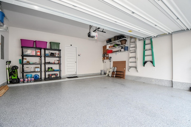 garage featuring baseboards and a garage door opener