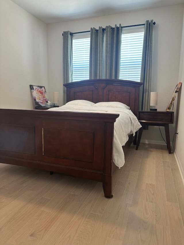 bedroom with light wood-type flooring