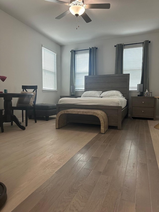 bedroom featuring ceiling fan and light wood finished floors