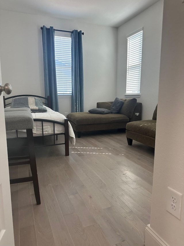 bedroom with wood finished floors