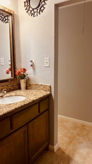 bathroom with vanity and tile patterned floors