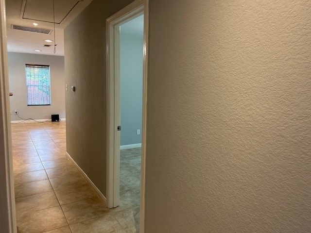 corridor with light tile patterned floors