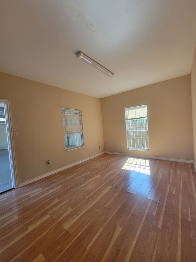 spare room with light hardwood / wood-style flooring