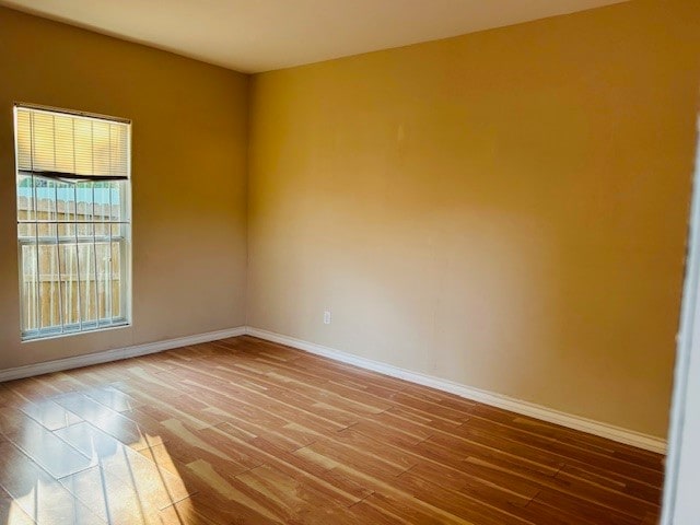 unfurnished room featuring hardwood / wood-style floors